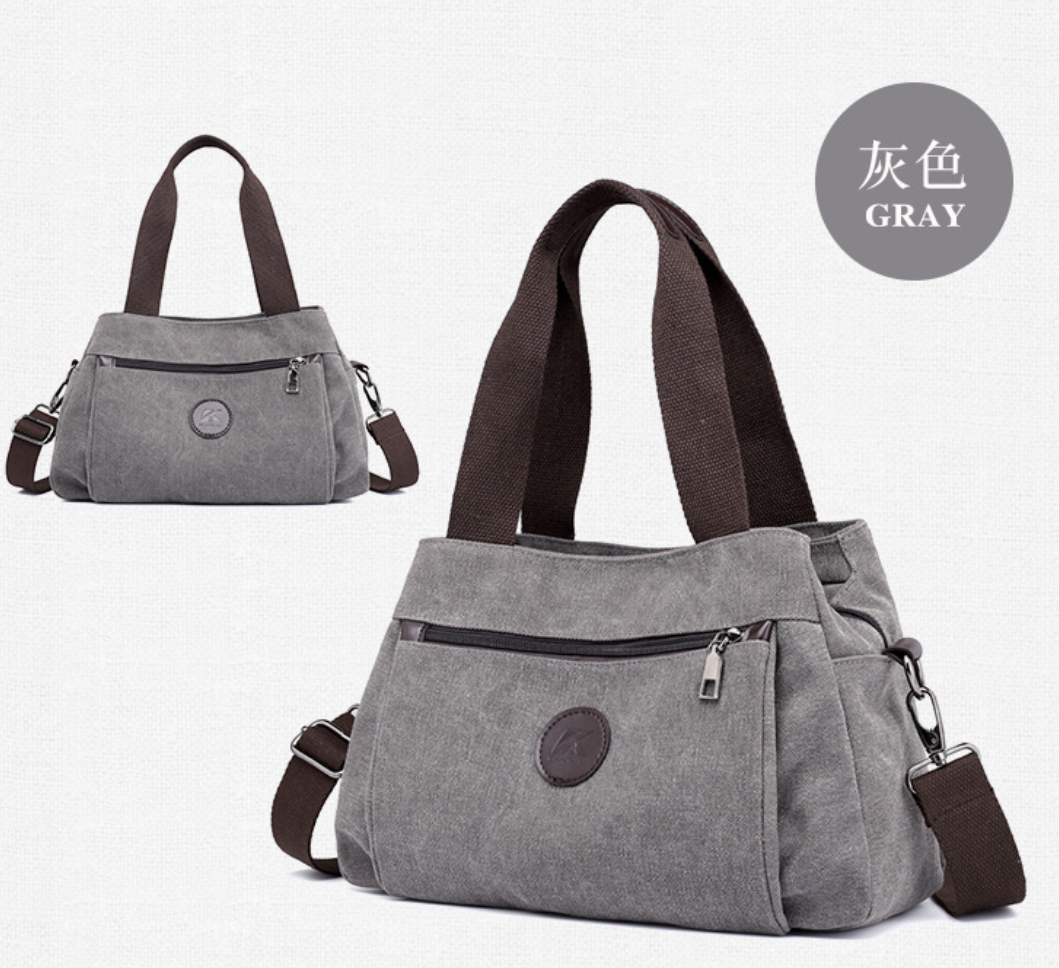 AB-28 soft canvas tote bag in gray with multiple compartments, zip pocket, phone pocket, and document pocket