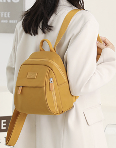 Casual womens backpack by dropshipping in mustard yellow nylon with a hidden storage pocket and laptop fit