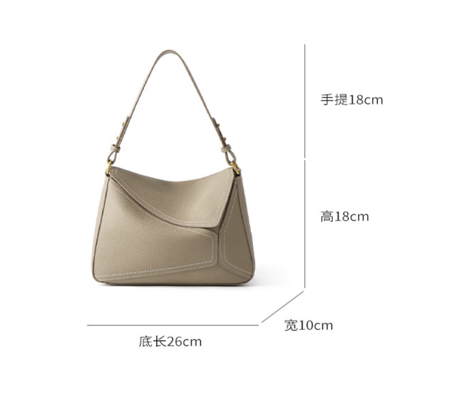 AB-28 crossbody bag in taupe with adjustable shoulder strap and multiple pockets, shown front view