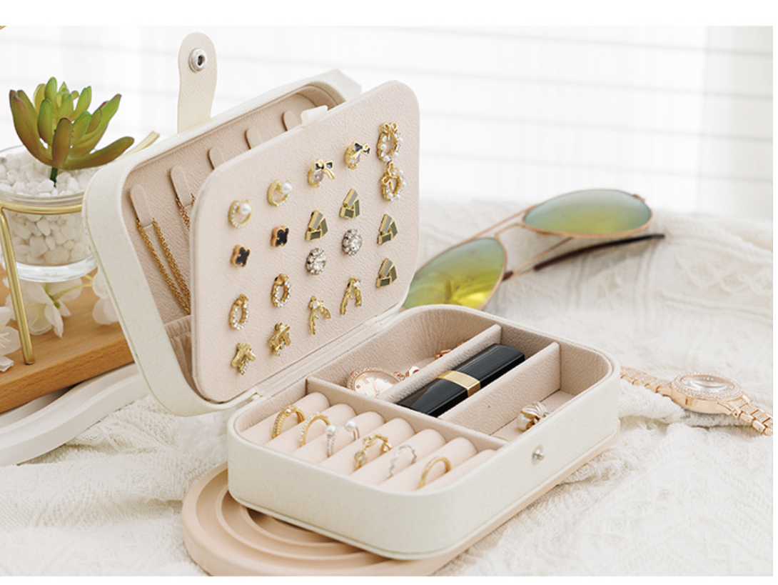 Elegant AB-28 jewelry box in light beige hard leather with velvet lining for organizing rings and earrings