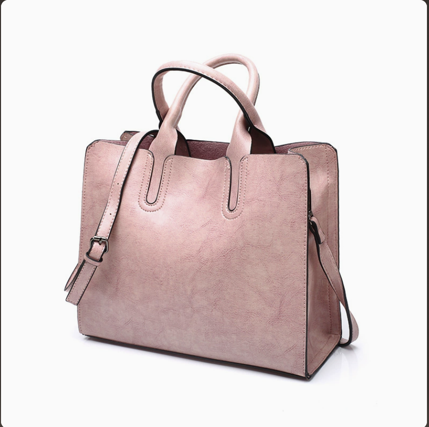 Women winter handbag by AB-28 in dusty pink faux leather with multiple pockets and zip closure