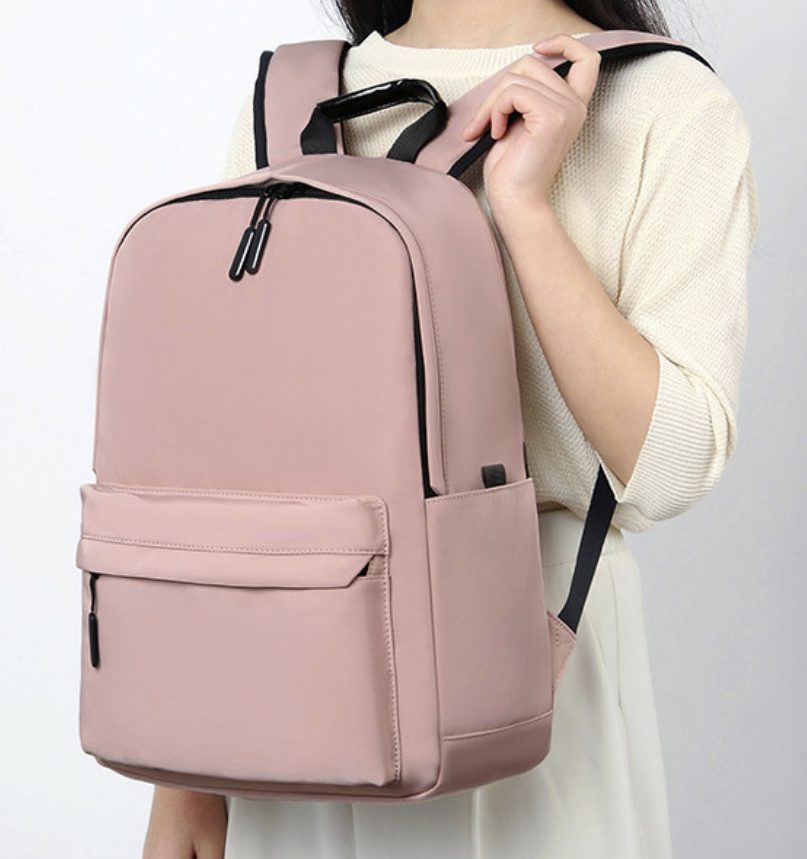 Dropshipping casual laptop backpack in dusty pink with padded shoulder straps for comfortable carrying